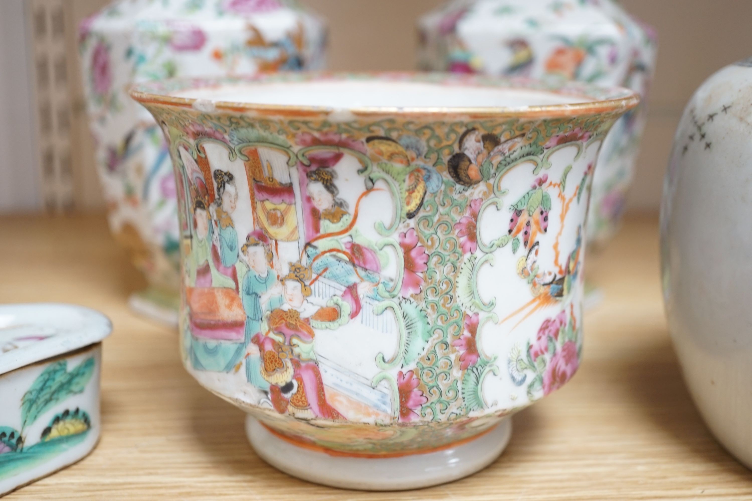 A group of 19th-century Chinese enamelled porcelain vessels, to include a jar, a pair of hexagonal vases, a pot and a cricket cage, Pair of vases 22cm high.